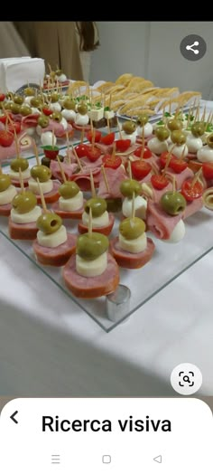 an assortment of appetizers are displayed on a table