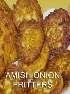 some fried food on a white plate with the words amish onion fritters