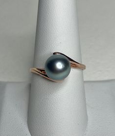 This is a pre loved ring that was crowned with a genuine Tahitian pearl that is slightly oval and 8.9mm wide. The ring is a size 8.75 of solid 14k rose gold. The ring weighs 3g. Formal Oval Rose Gold Pearl Ring, Tahitian Pearl Ring, Pearl Engagement Ring, Tahitian Pearls, Love Ring, Pearl Ring, Rings Statement, Statement Rings, Jewelry Rings