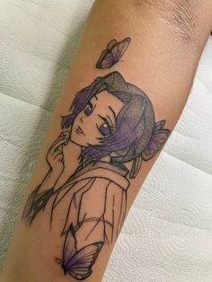 a girl with purple hair and butterfly tattoo on her arm