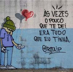 graffiti on the side of a building with a person holding a heart balloon in spanish