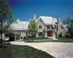 a large brick house with lots of windows