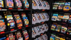 there are many video games on display in the store