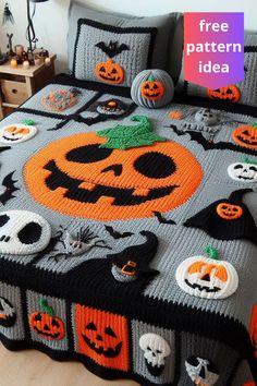 a crocheted halloween bed spread with pumpkins and jack - o'- lanterns