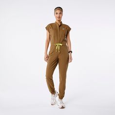 Official FIGS® Scrubs. Ridiculously Soft Scrubs Designed Just For You. Get Free Shipping On Orders $50+! | FIGS Womens Earth Rafaela - Cargo ScrubJumpsuit™ Fig Scrubs, Nurse Fashion Scrubs, Green Fig, Nursing Fashion, Figs Scrubs, Awareness Ribbon, Dental Assistant, Awareness Ribbons, Scrub Tops