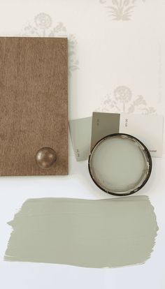 the paint is being used to create a wallpaper design with white and gray colors