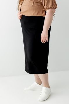 Everyday glam doesn't get easier than the pull on Sasha skirt! It's effortless and elegant - what skirt dreams are made of! Tailored in a modern midi length, this soft knit skirt is fitted with a hidden elastic waistband for a secure fit. From everyday wear to business casual to Sunday morning - this basic skirt is a must have for every modest wardrobe! Exclusively designed with you in mind. 95% Rayon 5% Spandex Hand Wash Cold Do Not Bleach Lay Flat or Hang to Dry Low Iron if Needed Lined Model Modest Fitted Skirt With Elastic Waistband, Stretch Lined Maxi Skirt For Daywear, Chic Pencil Skirt For Loungewear, Modest Stretch Midi Skirt, Modest Stretch Skirt With Elastic Waistband, Chic Lined Skirt For Loungewear, Chic Loungewear Skirt With Elastic Waistband, Chic Skirt With Elastic Waistband For Loungewear, Stretch Maxi Skirt With Elastic Waistband For Daywear