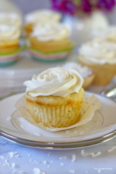 vanilla rum coconut cupcakes on a plate