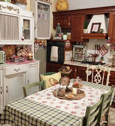 a kitchen with an old fashioned table and chairs in front of the stove top oven