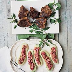 some food is sitting on a plate with utensils and napkins next to it