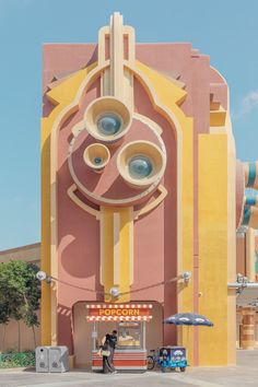 a large building with two giant speakers on it's side