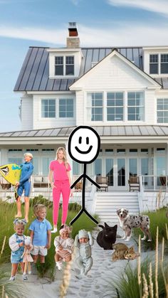 a family standing in front of a house with their dog and cat on the beach