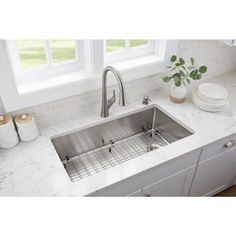 Enhance your kitchen interior with this Glacier Bay all-in-1 undermount single bowl kitchen sink. It includes a single handle pull-down kitchen faucet with a pull-down sprayer head, bottom grid, drain, strainer, soap dispenser and mounting hardware. As you work, it delivers noise reduction. For easy cleaning, it offers tight 15 mm radius corners. This sink features sturdy corrosion-resistant 18-Gauge brushed stainless steel and a brushed nickel f Industrial Kitchen Faucet, Best Kitchen Sinks, Corner Kitchen, Sinks Kitchen Stainless, Stainless Sink, Kitchen Board, Steel Kitchen Sink