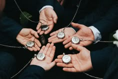 several people are holding their hands together in chains