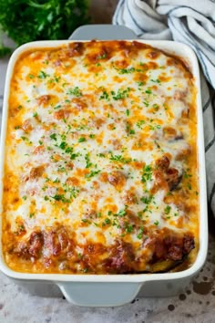 a casserole dish filled with meat and cheese