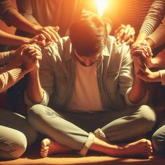 a group of people sitting in a circle with their hands together