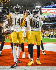 two football players are standing on the field