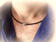 The minimalistic choker necklace for men is a stainless steel bead on a genuine leather cord with stainless steel lobster clasp closure. This stylish and concise choker for every day will be a great gift for him. Necklace length (adjustable): 17-19 inches (43-48 cm) Stainless steel bead: 8 x 6 mm Leather cord thickness: 3 mm For all products are used only genuine high-quality Italian leather, natural stones and wood. All metal materials are lead and nickel free. /Gift wrapping and packaging/ : A Minimalist Everyday Jewelry With Adjustable Cord, Leather Necklace For Men, Mens Leather Necklace, Necklace Everyday, Stone Choker, Leather Wristbands, Black Bead Necklace, Leather Chokers, Men Jewelry