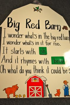 a sign that says, big red barn i wonder what's in the bag for me