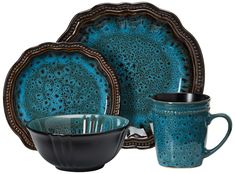 a blue and black dinnerware set with matching cups