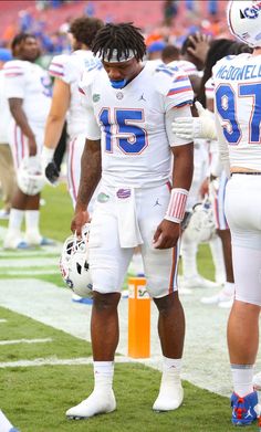 two football players are standing on the field