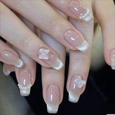 a woman's hands with french manies and nail polish on their nails,