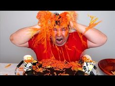 a man with orange hair is in front of a cake that looks like it has been eaten