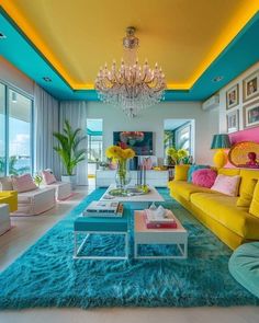 a living room filled with lots of furniture and colorful decor on top of blue rugs