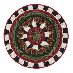 a red, black and white round rug with an ornate design on the center is shown