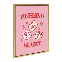 a pink canvas with red lettering that says feeling lucky and dices on the bottom