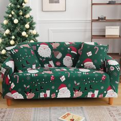 a christmas themed couch in front of a christmas tree