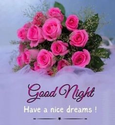 a bouquet of pink roses sitting on top of a white sheet with the words good night have a nice dreams