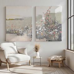 a living room with two paintings on the wall