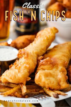 fried fish and fries on a plate with dipping sauce