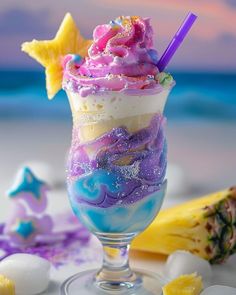 an ice cream sundae with purple, blue and yellow swirls