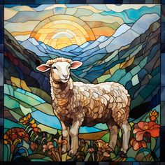 a stained glass window with a sheep standing in front of the sun and mountain landscape