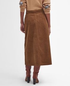 If you're looking for a new way to elevate your wardrobe without investing in bright colours or prints, we recommend trying texture. The Barbour Samara Cord Midi Skirt offers a sophisticated and timeless A-line silhouette crafted from soft cotton corduroy and detailed with angled pockets for extra dimension. Fastened with bright brass, branded snap button closure and ID tag to the waist, this style complements shirts and T-shirts alike for a versatile addition to your wardrobe. Flared Wrap Skirt For Work, China Dress, Jumper Shirt, Fleece Pants, Samara, Bright Colours, T Shirt Vest, Id Tag, Casual Jacket