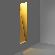 an empty room with light coming in from the window and on to the floor, there is a yellow door