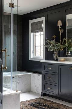 a bathroom with black walls and marble counter tops