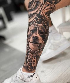 a man with a dog tattoo on his leg