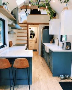 the kitchen is clean and ready to be used as a dining area in this tiny home