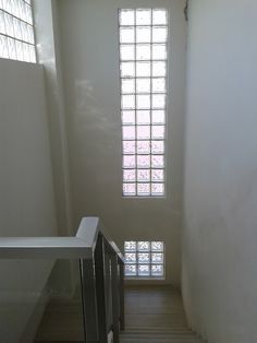 the stairs lead up to an open window