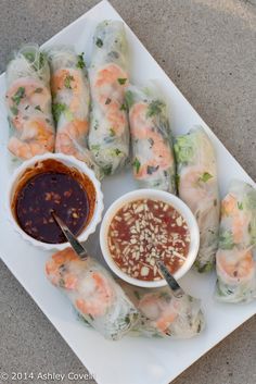 a plate with shrimp rolls and dipping sauce