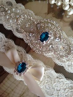 This beautiful, vintage inspired, 1.5 inch ivory lace (shown) or bridal white lace applique wedding garter set includes the Keepsake and Toss garters and will be perfect for you on your special day! The Keepsake garter is designed with one gorgeous all rhinestone crystal clear applique with a gorgeous rhinestone center of your choice (shown is #4 turquoise). The applique measures approximately 2 inches x 6 inches; the Toss garter is designed with the same gorgeous rhinestone attached to an ivory Bride Garter, Bridal Garter Lace, Lace Garter Set, Garter Toss, Blue Garter, Something Blue Bridal, Wedding Garter Set, Wedding Garters, Applique Wedding