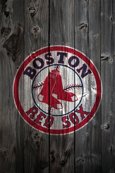 the boston red sox logo is painted on a wooden fence