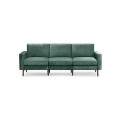 a green couch sitting on top of a white floor