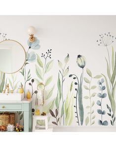 a bathroom wall with flowers and plants painted on the walls, along with a mirror