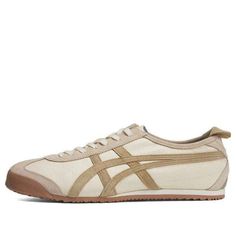 The Onitsuka Tiger MEXICO 66 Shoes in Cream Beige Brown are a timeless classic. Crafted from premium leather, these sneakers feature the iconic tiger stripes and MEXICO 66 branding, adding a touch of heritage to any outfit. Experience unparalleled comfort with the cushioned midsole and breathable lining. These coveted sneakers are perfect for everyday wear or special occasions.  Onitsuka Tiger is a Japanese sports brand known for its iconic designs and commitment to quality. Cherry Blossom Embroidery, Blossom Embroidery, Shoes Cream, Tiger Mexico 66, Onitsuka Tiger Mexico 66, Mexico 66, Limited Edition Shoes, White Cherries, Limited Edition Sneakers