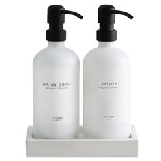 two bottles of lotion sitting on a shelf