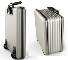 two suitcases side by side, one in white and the other in silver with black handles